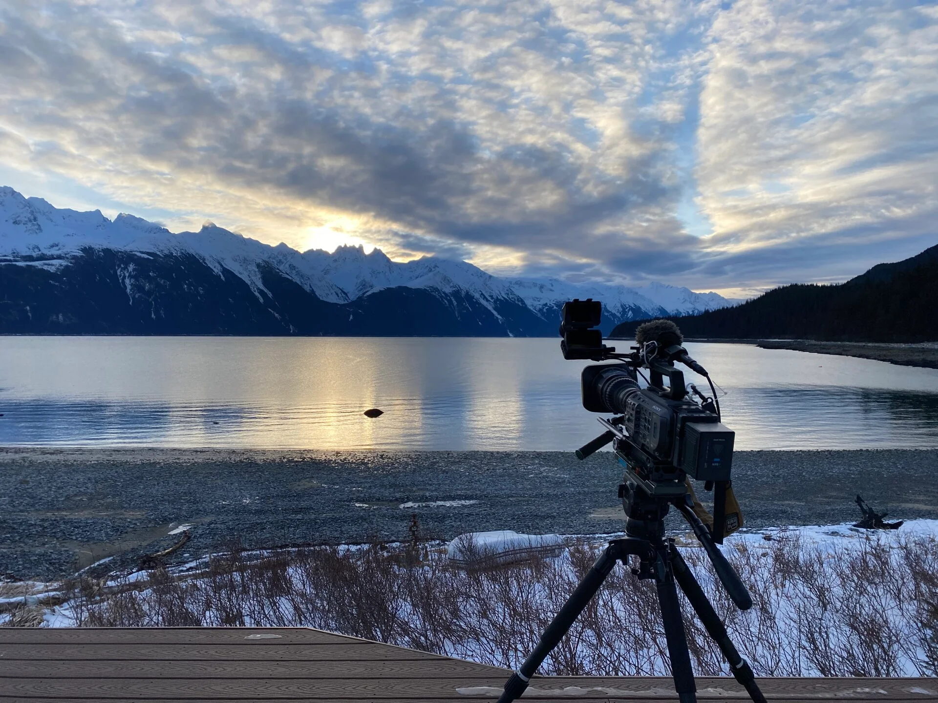 Camera set up beside a remote mountain lake